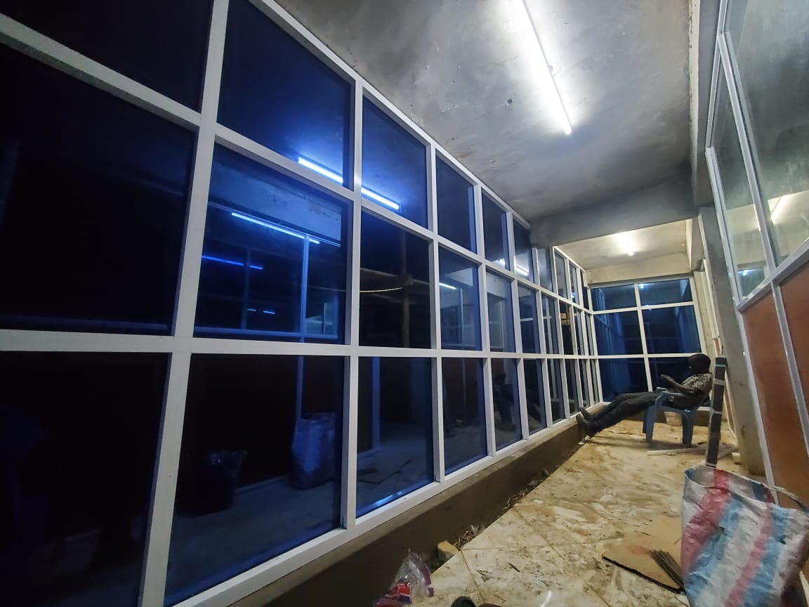 The BestLink Fabricators team installing an aluminium curtain wall